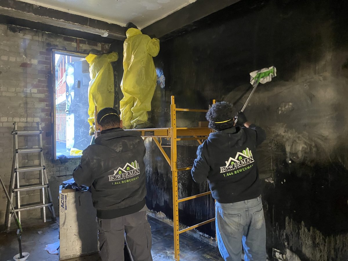 Fire damage restoration crew working on site